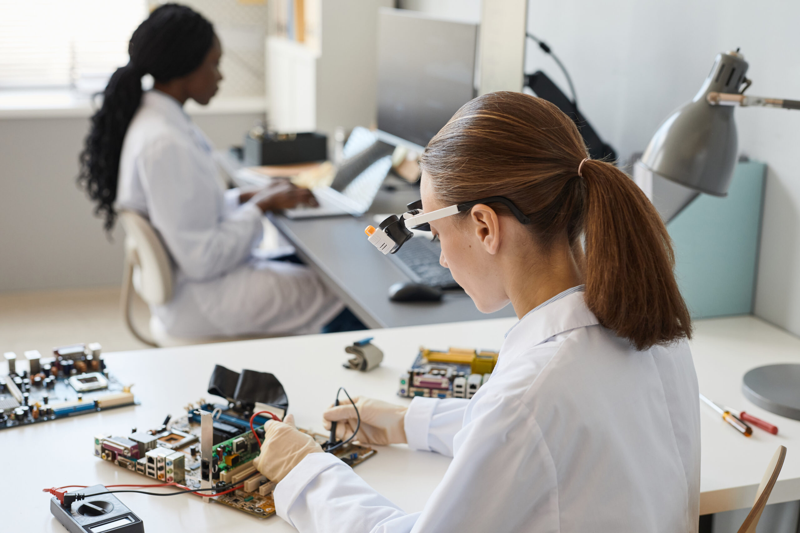 two women sitting in a laboratory